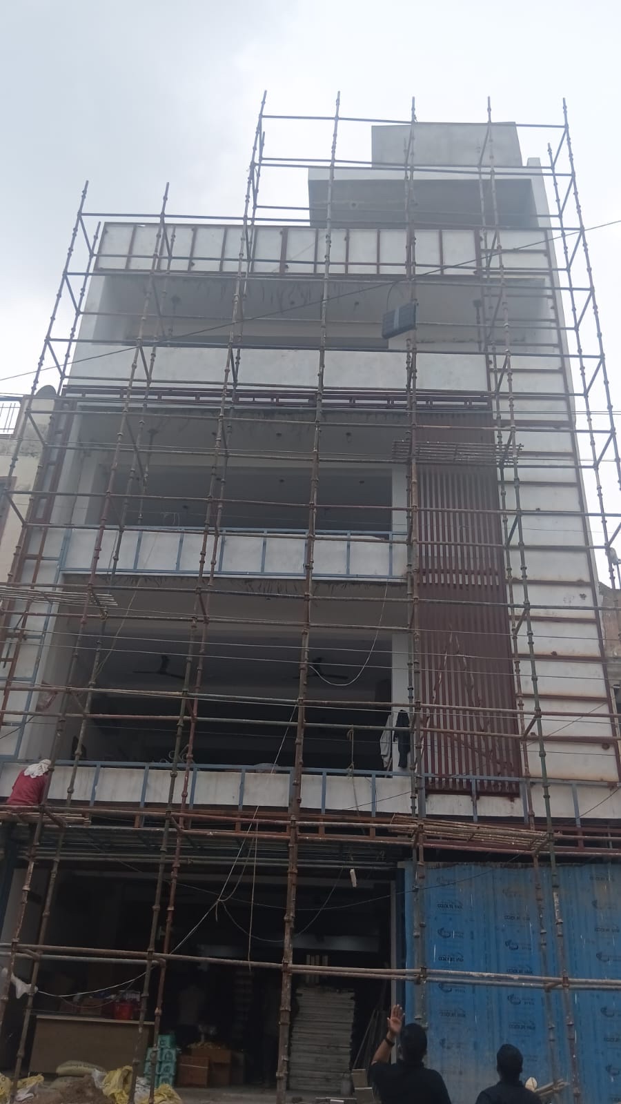Baba Daal building under scaffolding during facade glazing by FC Glass